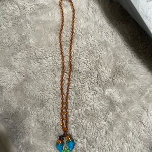 Amber and Blue Beaded Necklace with twin fishes!: two fishes symbolized harmony